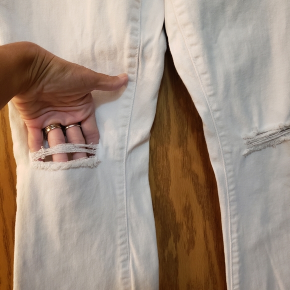 Cute white jeans, ripped at knees with flare bottoms. Great condition. - Picture 5 of 8